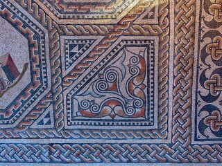 Decorative corner with geometric ornamented borders of Roman floor mosaic which is freely accessible for everybody outdoors in Vitchen, Luxembourg