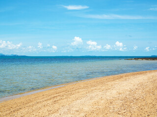 Beautiful blue sea beach. Against the sky and white clouds.