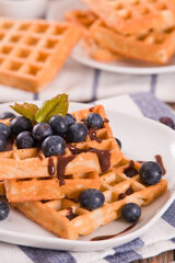 Waffles with blueberries and chocolate cream.