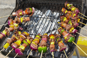 Cooking Beef and vegetables skewers on the grill