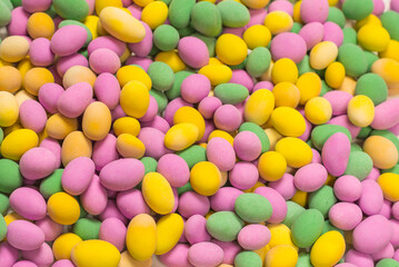 Group of colorful peanuts in glaze.
