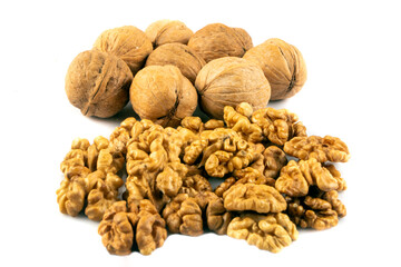 Delicious whole and broken walnuts isolated on white background. Whole and cracked walnut.