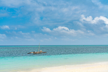 A Boat at the tropical white beach of Zanzibar island. Tanzania. Eastern Africa