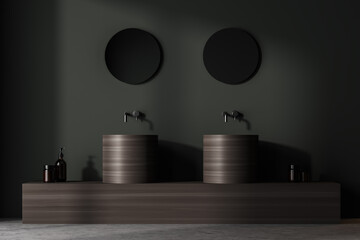Dark bathroom interior with two sinks and mirrors