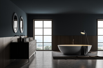 Obraz na płótnie Canvas Bathroom interior with two sinks and bathtub with lamp