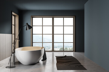 Obraz na płótnie Canvas Bathroom interior with bathtub and foot towel with lamp on grey floor, mockup canvas