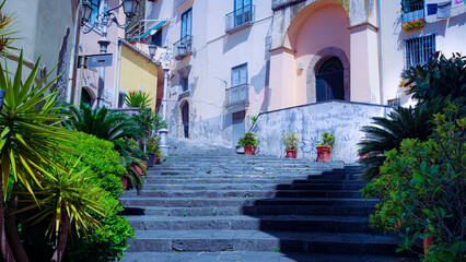Fototapeta na wymiar steps in the historic center of Salerno, Italy. murals and plants.