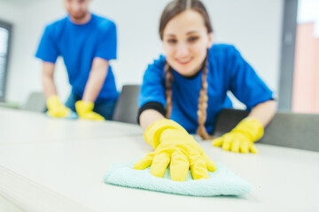 Close-up of cleaning team working in an office
