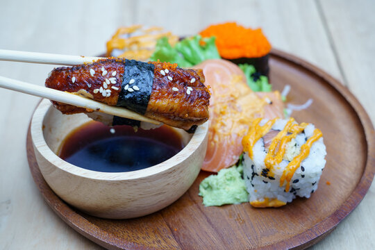 Unagi sushi nigiri in chopsticks