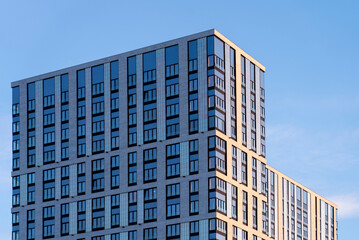 facade of a modern office residential building against the sky