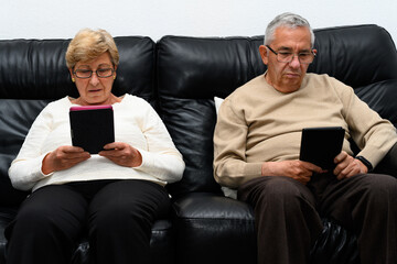 Woman and man read in an electronic book