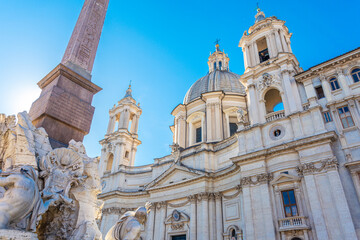 Fototapeta premium Navona Square and detail of the statue of the four rivers in Rome,Italy on a sunny day with blue sky.