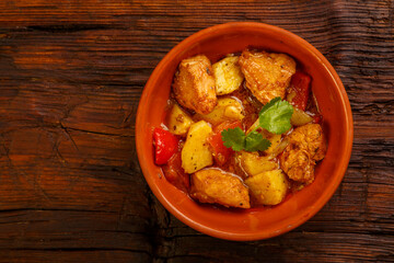 Food for suhoor in ramadan on a wooden table braised laran meat with potatoes. Copy space