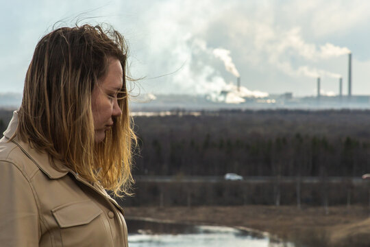 Air Pollution Pulp And Paper Mill And Sad Woman In The Foreground