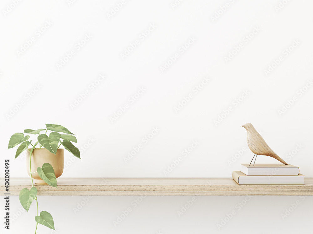 Poster interior wall mockup in neutral minimalist scandi style with trailing green plant and bird on wooden