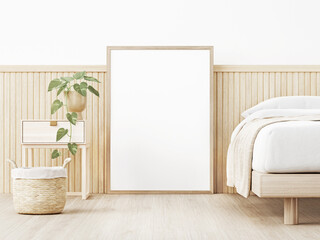 Vertical poster mockup with wooden frame standing on floor in warm neutral Japandi style bedoom interior with slat decor, basket and trailing plant on empty wall background. 3D rendering, illustration - obrazy, fototapety, plakaty