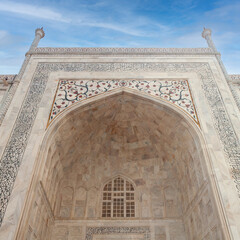 Exterior detail of famous Taj Mahal Mausoleum on sunrise in Agra, Uttar Pradesh state of India.