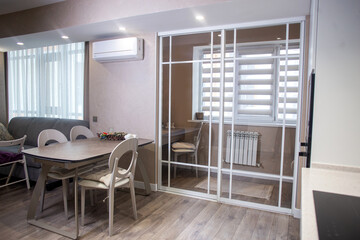 The interior of the room with a balcony. Stylish modern design