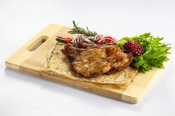 Grilled pork loin served onion