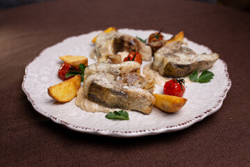 a dish of fish slices on white in a restaurant