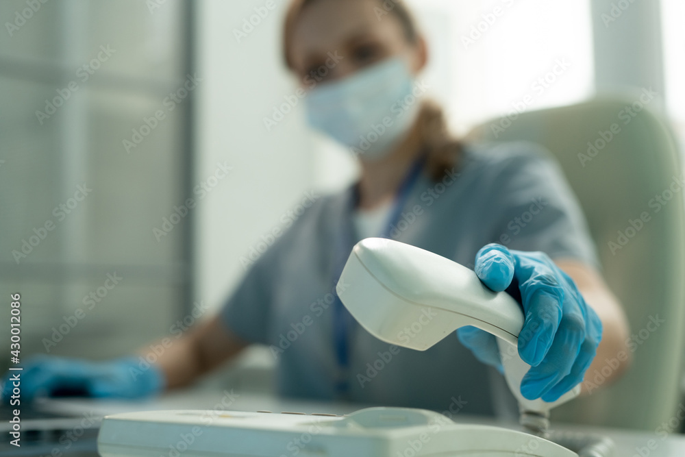 Poster lab worker picking up phone