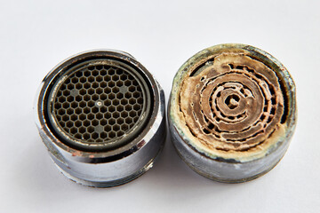 two aerators dirty with limescale deposits and after cleaning