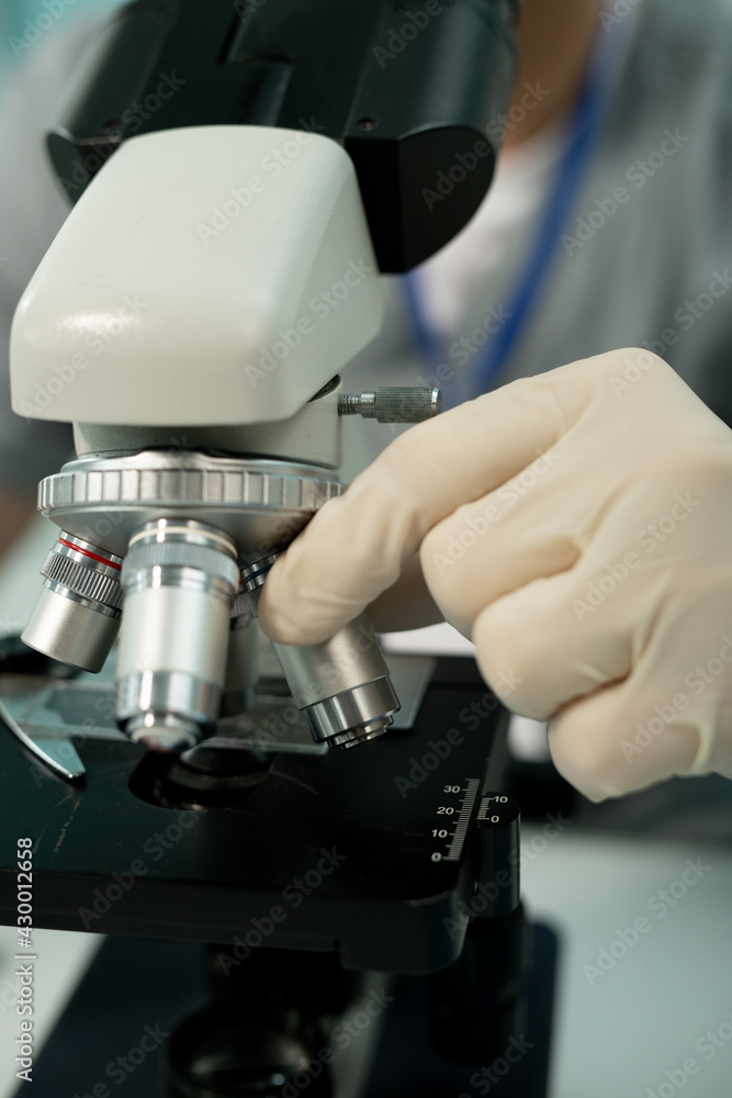 Poster Adjusting objective lens before microscope research