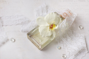 perfume bottle, phalaenopsis orchids, lace, beads