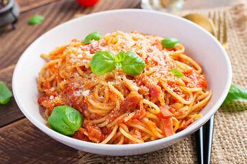 Spaghetti alla Amatriciana with guanciale, tomatoes and pecorino cheese. Italian healthy food.