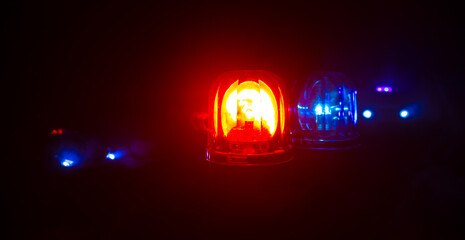 Police car blue and red round vintage siren in dark. Rotating retro style police siren in dark.