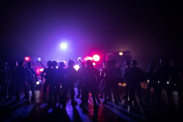 Anti-riot police give signal to be ready. Government power concept. Police in action. Smoke on a...