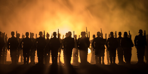 War Concept. Military silhouettes fighting scene on war fog sky background, World War Soldiers...