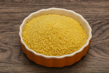 Raw cous cous heap in the bowl