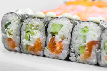 Sushi (a traditional dish of Japanese cuisine) on a white plate