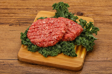 Raw beef burger cutlet for cooking