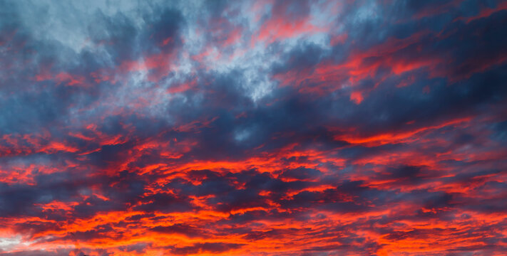 Amazing colourful dramatic sunset sky background, red clouds.