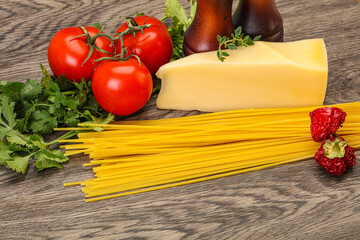 Raw Italian spaghetti heap with cheese