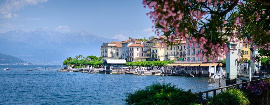 Bellaggio landscape, blue sky, pink floral in foreground