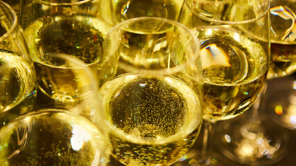 Glasses of white wine are on the table, ready to serve