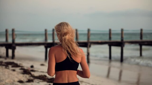 Jogging Before Triathlon Competition.Woman Run.Woman Running.Fitness Girl Running On Morining At Sea.Female Intensive Running.Exercising Runner Cardio Jogging.Fit Athlete Jogger Workout At Sunrise.