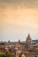 Fototapeta na wymiar Rome cityscape with sunset sky and clouds, Italy