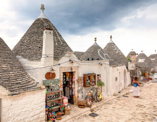 White streets of Alberobello village. Trulli buildings, Apulia, Italy