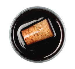 Glass red wine with cork isolated on white background, top view
