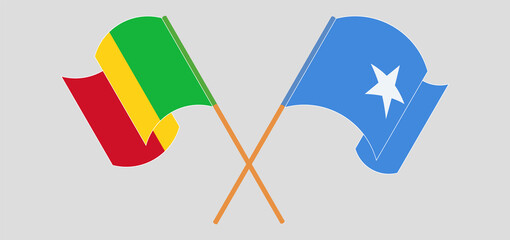 Crossed and waving flags of Mali and Somalia