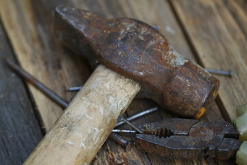 Old construction tools on the wooden floor