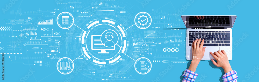 Wall mural document management system concept with person using a laptop