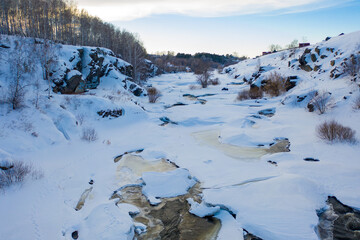 Wetlands with small river covered by snow. Many footprints of wild animals, Aerial View, HEAD OVER SHOT