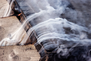 Catching fire boards and lots of smoke. Close-up