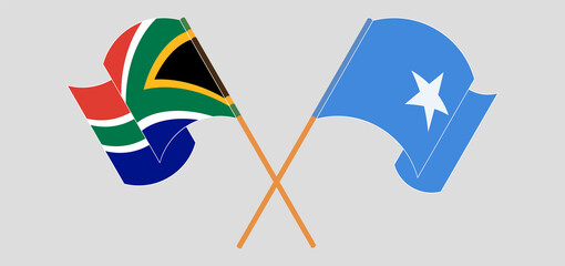 Crossed and waving flags of Republic of South Africa and Somalia