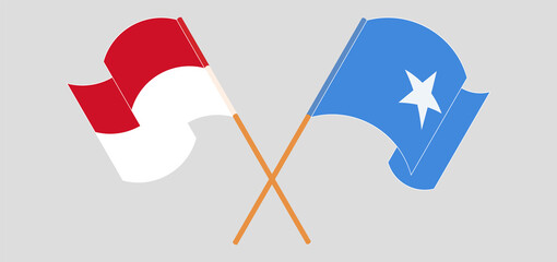 Crossed and waving flags of Indonesia and Somalia